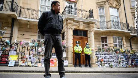 Former Myanmar Ambassador to the UK Kyaw Zwar Minn listens to a statement being read on his behalf as he stands outside the Myanmar Embassy on April 8, 2021 in London, England. 