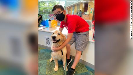 Brody Parker is shown with one of the therapy dogs that visit the Children&#39;s Healthcare of Atlanta hospitals.