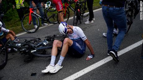 Froome lies on the road after crashing in the second crash of the first stage of the Tour de France.