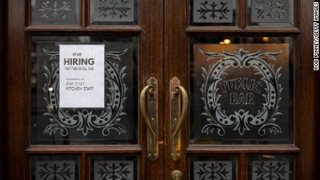 A hiring sign is seen in the window of a pub in Westminster on June 4, 2021 in London, England. Demand for workers in the hospitality sector has increased significantly following the easing of coronavirus restrictions, but many businesses are struggling to find staff. 