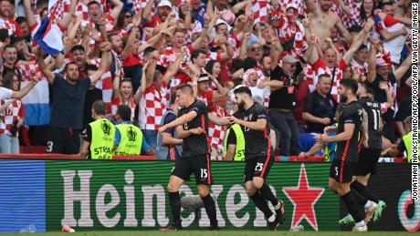 Mario Pasalic celebrates after equalizing for Croatia in stoppage time.