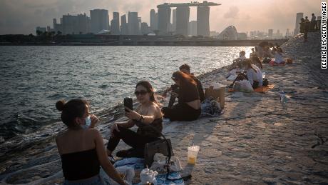 In May, Singapore reduced the number of people who could socialize together from five to two. 