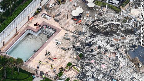 This aerial view shows search and rescue personnel working on site after the partial collapse of the Champlain Towers South in Surfside, Florida, on June 24, 2021. 