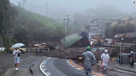 A road is covered by mud and debris following heavy rain in Atami city on July 3. 