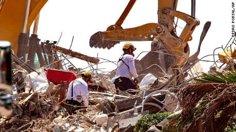 Rescue teams from Pennsylvania search the rubble of the Champlain Towers South on July 8.