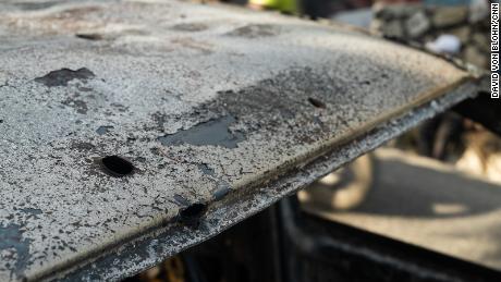 The charred shell of a car following the killing of Haiti&#39;s President. 
