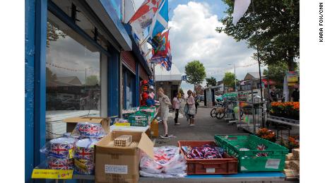 A girl peruses an array of marching season paraphernalia on the Shankill Road in west Belfast. 