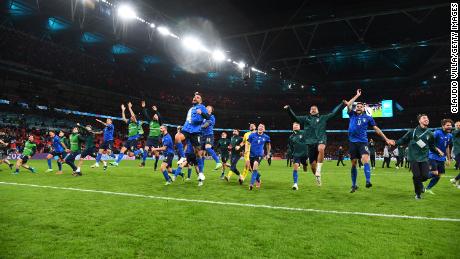 Players of Italy celebrate following their team&#39;s victory in the penalty shootout of the semi-final match against Spain.