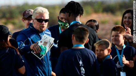 Richard Branson receives some cards from children as he walks out from Spaceport America, near Truth and Consequences, New Mexico on July 11, 2021.