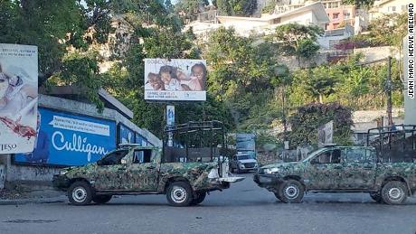 Haitian security forces&#39; vehicles blocking the road.