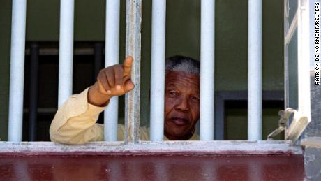  Nelson Mandela stares out of the window of the prison cell he occupied on Robben Island for much of his 27 year prison sentence. It was at Robben that Mandela learned the language and ways of his White jailers. 