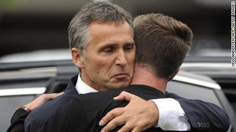 Norway&#39;s then-Prime Minister Jens Stoltenberg, left, embraces Eskil Pedersen, leader of the Norwegian Labour Youth league and a survivor of the Utoya attack, on July 23, 2011.