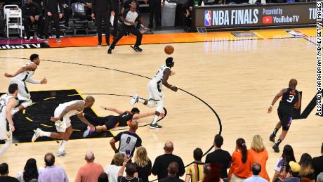 Jrue Holiday #21 of the Milwaukee Bucks steals the ball from Devin Booker #1 of the Phoenix Suns during Game Five of the 2021 NBA Finals on July 17, 2021 at Footprint Center in Phoenix, Arizona. 