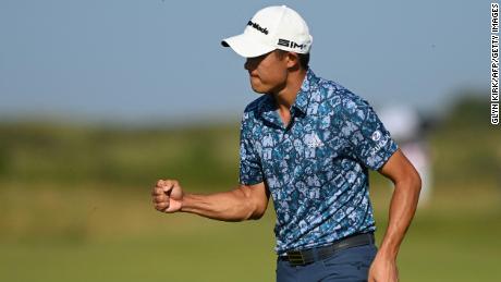 Morikawa celebrates after a putt on the 14th green during his final round of the Open.