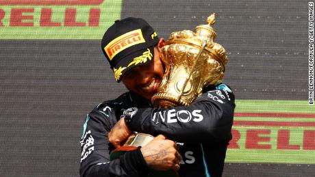 Lewis Hamilton celebrates in the Silverstone rostrum.