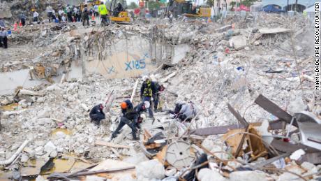 In a photo released by Miami-Dade Fire Rescue on July 10, crews work at the site of the residential building collapse. 