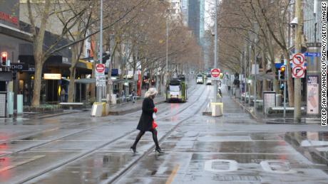 A Woman In Melbourne'S Nearly Empty City Center During This Month'S Lockdown. 