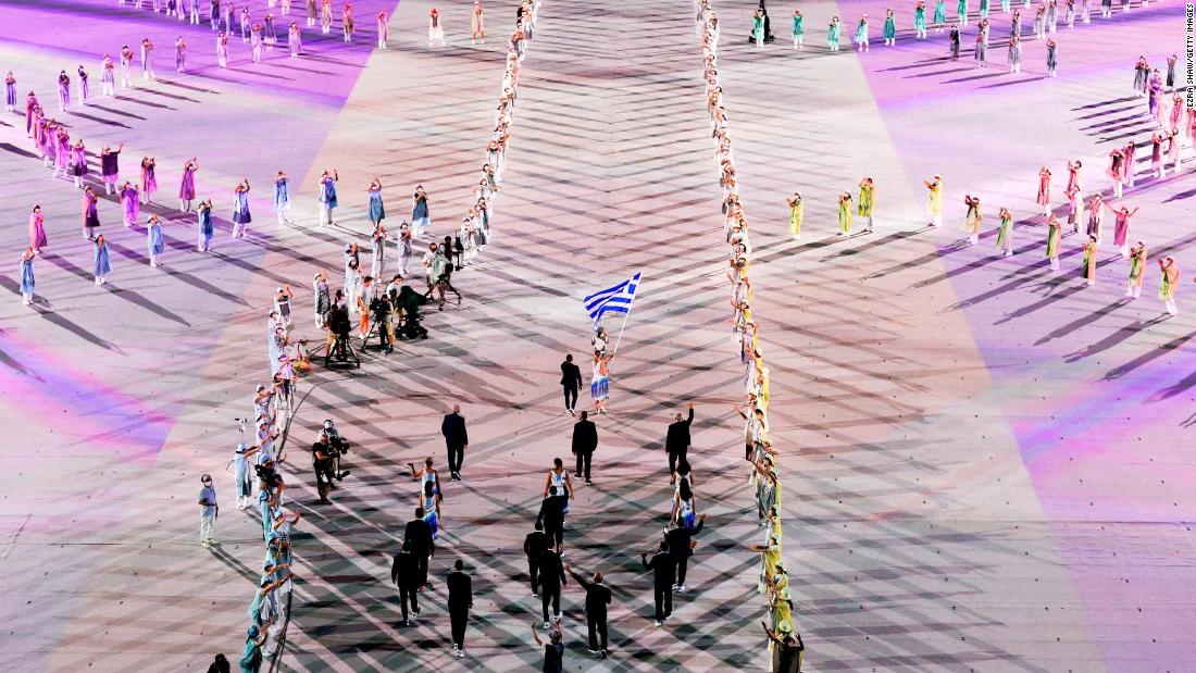 Greece&#39;s athletes march into the stadium to kick off the parade of nations.