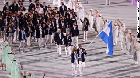 Flag bearers Cecilia Carranza Saroli and Santiago Raul Lange of Team Argentina lead their team in the stadium during the Opening Ceremony of the Tokyo 2020 Olympic Games.
