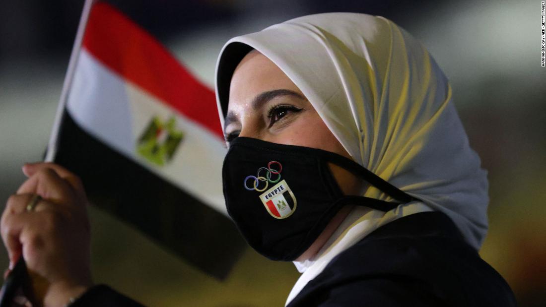 A member of Egypt&#39;s delegation enters the stadium during the parade of nations.