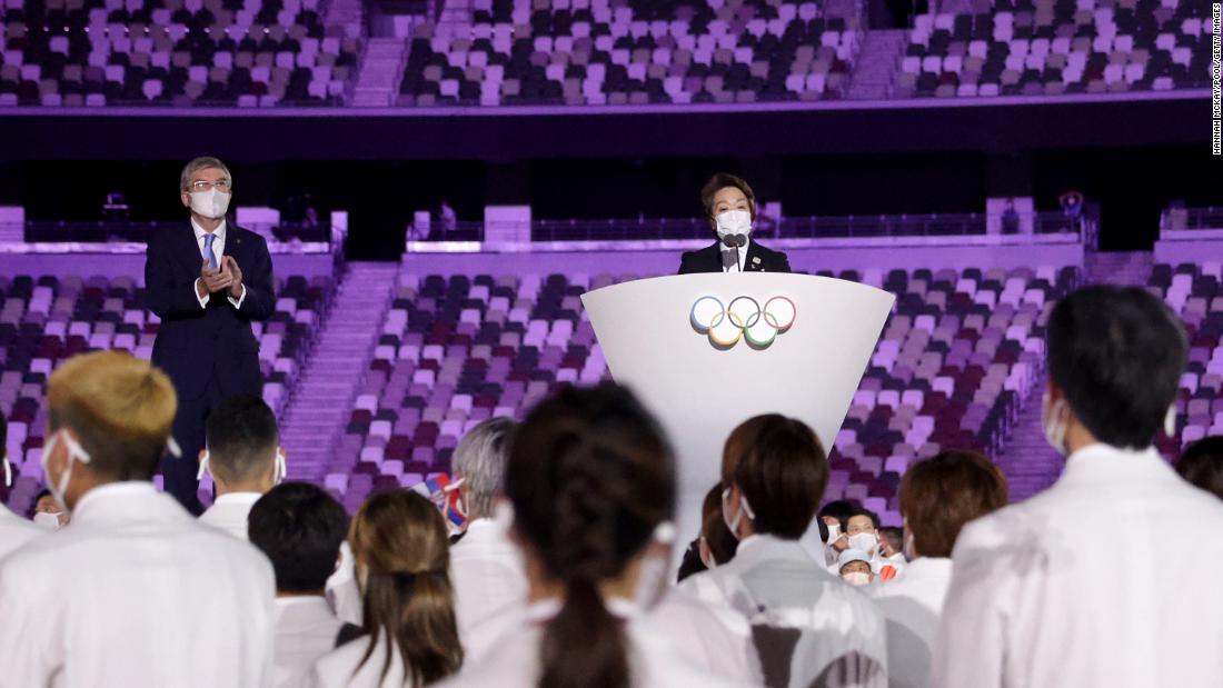 Seiko Hashimoto, president of the Tokyo 2020 organizing committee, makes a speech during the opening ceremony. At left is Thomas Bach, president of the International Olympic Committee.