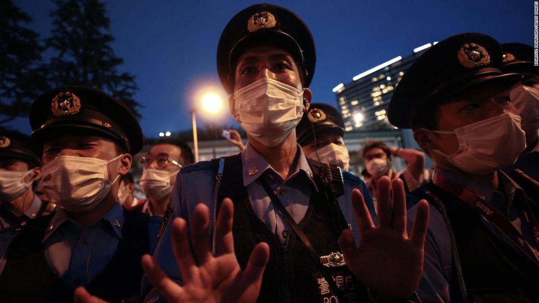 A police officer gestures toward a small group of people who were protesting the Olympics outside the stadium on July 23. A significant portion of the Japanese public &lt;a href=&quot;https://www.cnn.com/2021/07/22/sport/tokyo-olympics-preview-spt-intl/index.html&quot; target=&quot;_blank&quot;&gt;opposes holding the Olympics in the middle of a pandemic.&lt;/a&gt;
