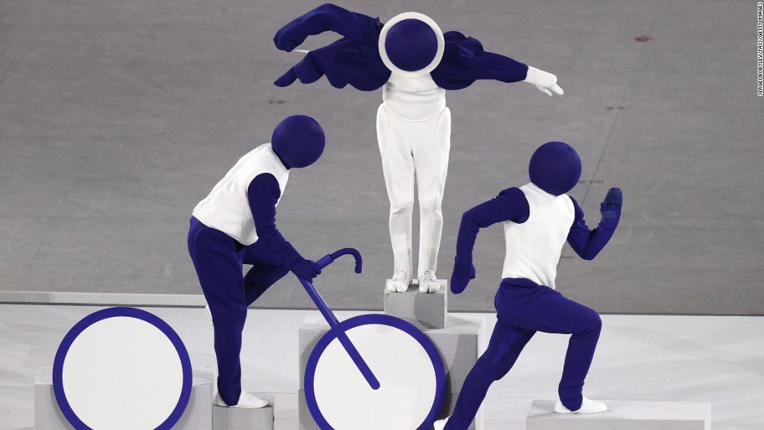 Live performers pose as the triathlon pictogram during the opening ceremony. There were 50 sports taking place this year in the Tokyo Olympics, and all of their &lt;a href=&quot;https://olympics.com/en/news/tokyo-2020-unveils-games-pictograms&quot; target=&quot;_blank&quot;&gt;pictograms&lt;/a&gt; were acted out by the performers.