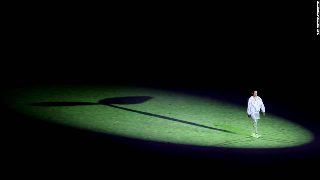 A lone performer is seen during the start of the opening ceremony.
