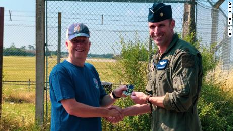 Photographer Ian Simpson meets fighter pilot Maj. Grant Thompson on July 20, 2021 after Simpson made a potentially lifesaving intervention when he spotted something wrong with Thompson&#39;s F-15E Strike Eagle fighter jet.