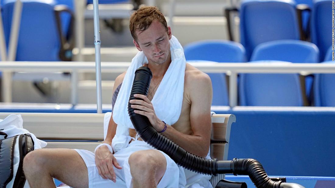 During a break in his first-round match, Russian tennis player Daniil Medvedev &lt;a href=&quot;https://edition.cnn.com/world/live-news/tokyo-2020-olympics-07-24-21-spt/h_06c4710f105dc100190c38cdf84b6a2a&quot; target=&quot;_blank&quot;&gt;cools down&lt;/a&gt; with a mobile air conditioner and a towel with ice cubes. &quot;It was some of the worst (heat) I&#39;ve ever had,&quot; he said after he beat Kazakhstan&#39;s Alexander Bublik.