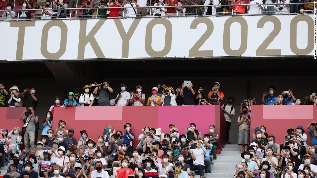 Fans wait at the finish of the men&#39;s cycling road race on July 24. The Fuji International Speedway, in Oyama, Japan, is one of the five Olympic venues open to fans this year.