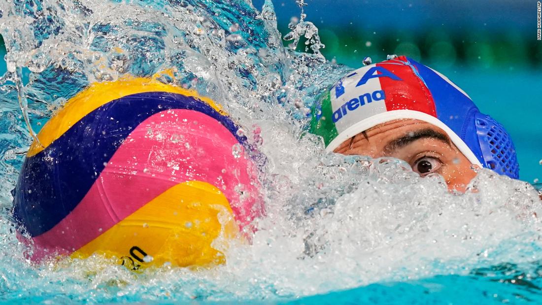 Italy&#39;s Alessandro Velotto moves the ball during a water polo match against South Africa on July 25.