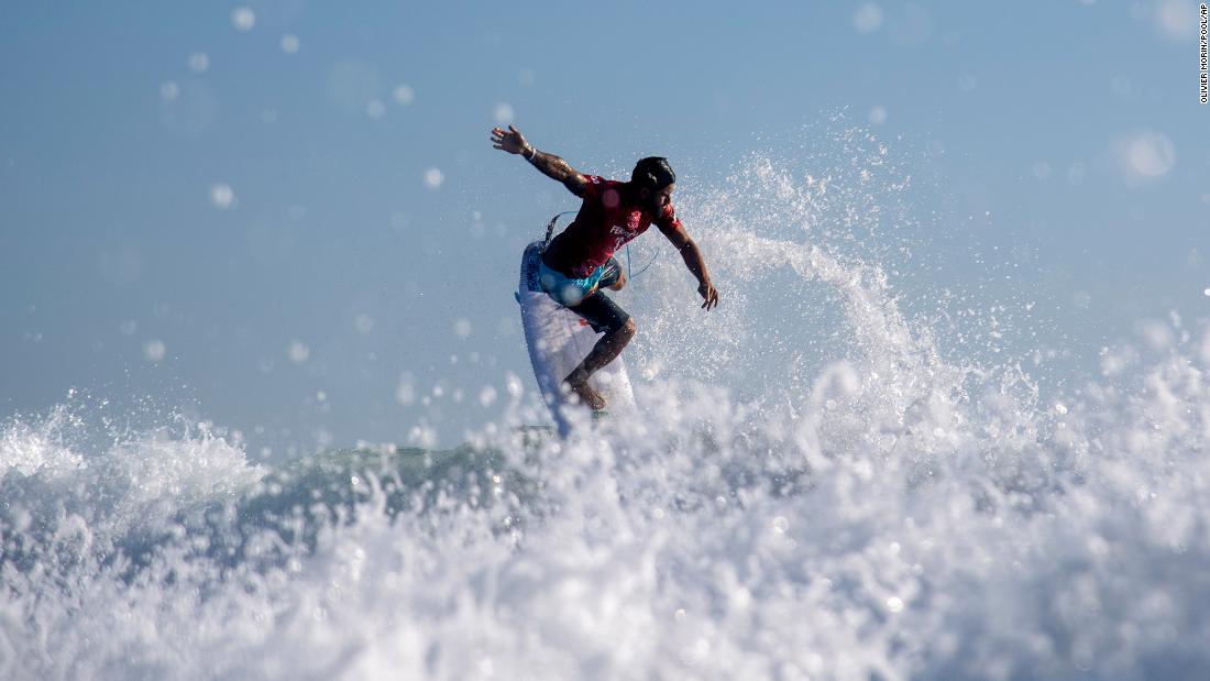 Brazilian surfer Italo Ferreira rides a wave during an early heat on July 25. This is the first year that surfing is in the Olympics.