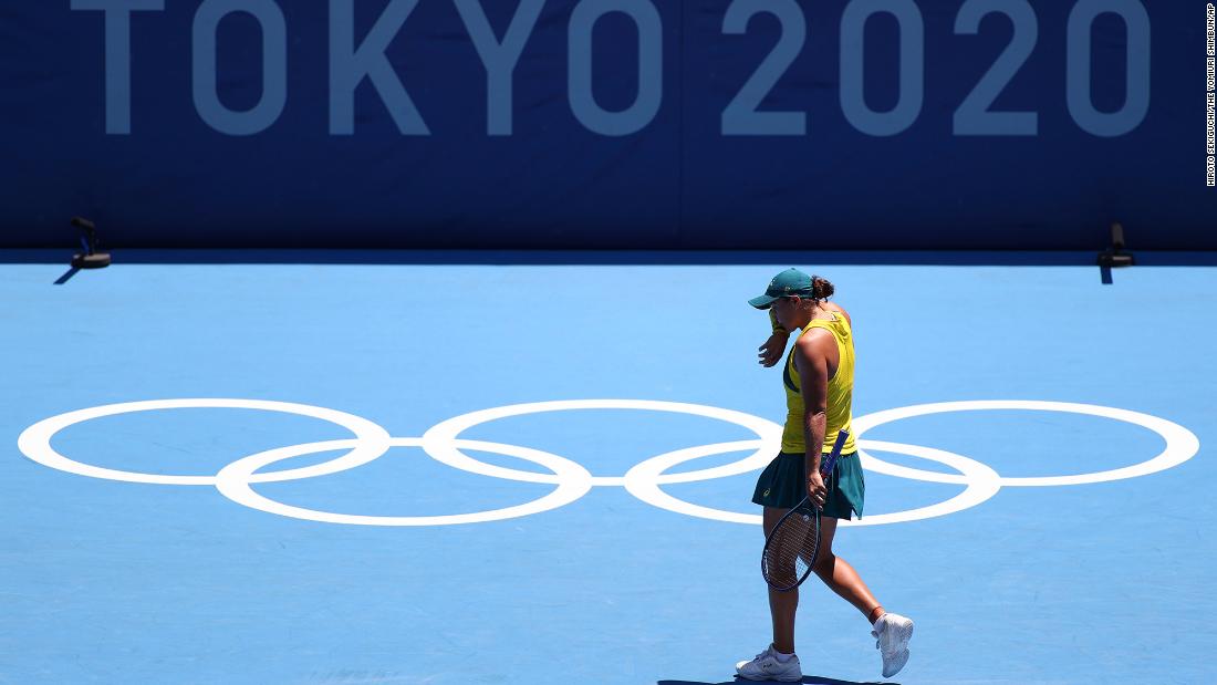Australian tennis star Ashleigh Barty, the world&#39;s top-ranked player who won Wimbledon earlier this month, reacts during her &lt;a href=&quot;https://www.cnn.com/world/live-news/tokyo-2020-olympics-07-25-21-spt/h_875b23b20b49f797a713d5a76988e298&quot; target=&quot;_blank&quot;&gt;first-round loss &lt;/a&gt;to Spain&#39;s Sara Sorribes Tormo on July 25. Sorribes Tormo won 6-4, 6-3.