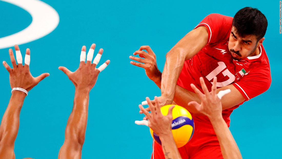 Iran&#39;s Meisam Salehi spikes the ball during a volleyball match against Venezuela on July 26.