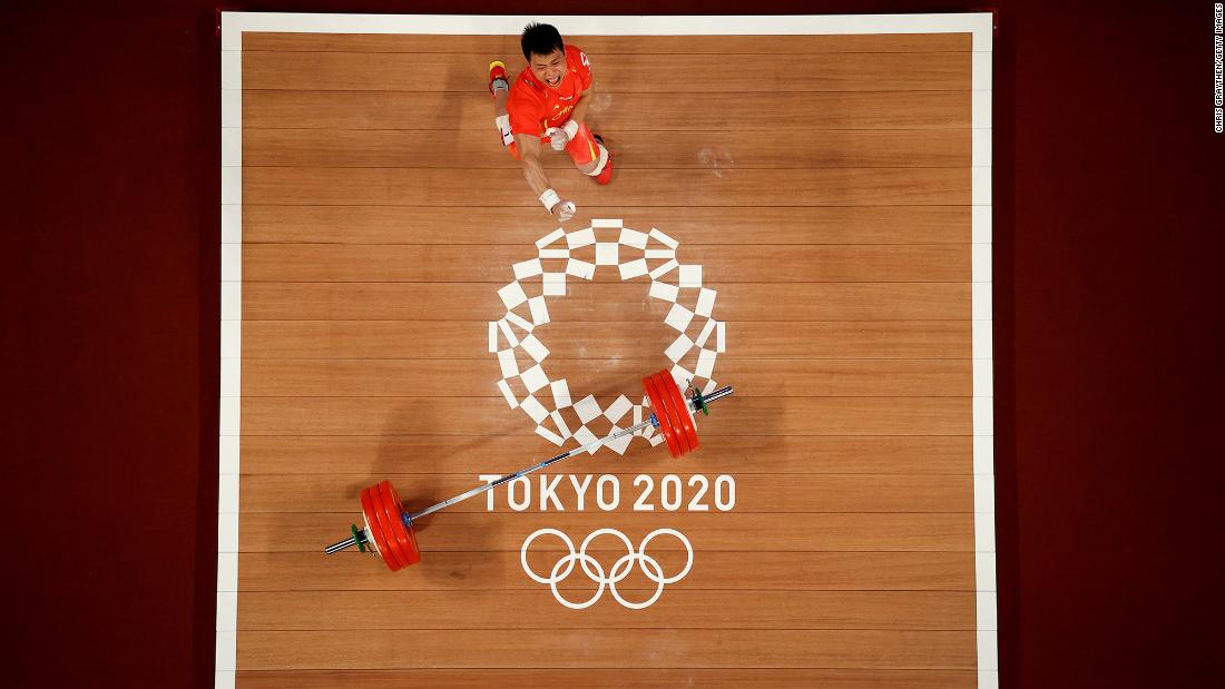 Chinese weightlifter Chen Lijun celebrates on July 25. He won gold in his 67-kilogram weight class after lifting 187 kilograms — an Olympic record — in the clean-and-jerk. His total lift of 332 kilograms edged Colombia&#39;s Luis Javier Mosquera Lozano by one kilogram.