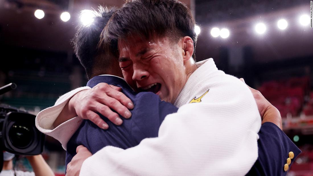Japan&#39;s Hifumi Abe celebrates after winning gold in judo on Sunday, July 25.