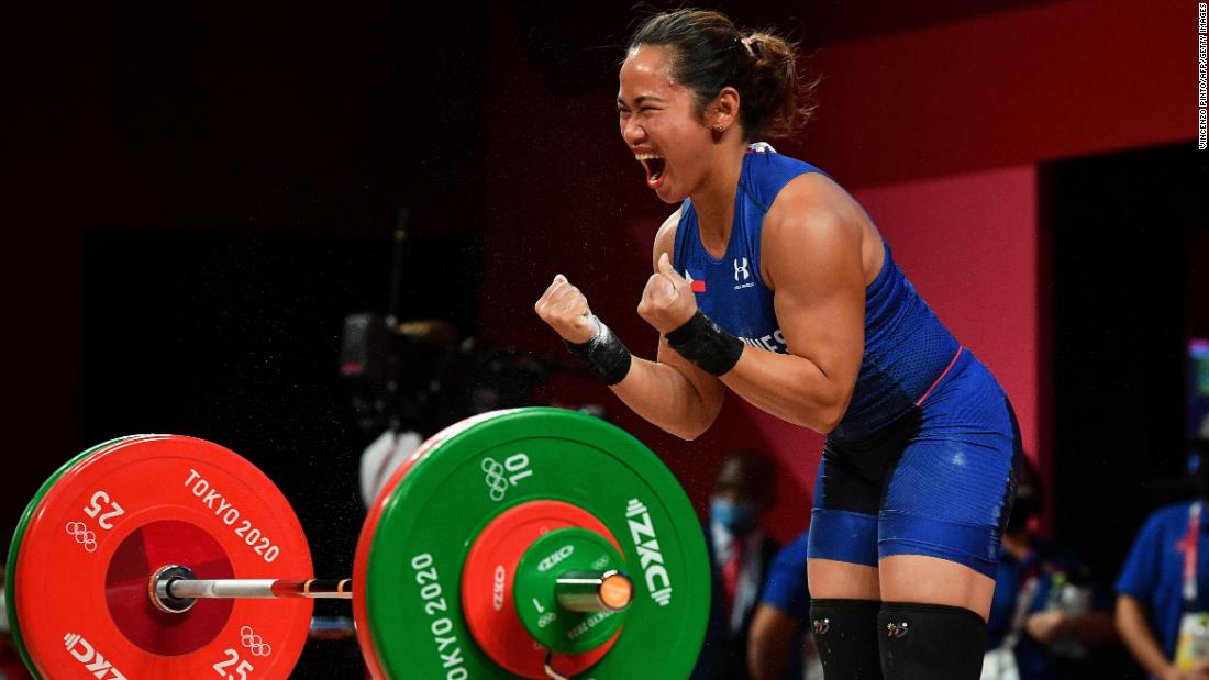 The Philippines&#39; Hidilyn Diaz reacts after winning the 55-kilogram weightlifting competition on July 26. It&#39;s her country&#39;s &lt;a href=&quot;https://www.cnn.com/world/live-news/tokyo-2020-olympics-07-26-21-spt/h_2d6ab10499b245fa129318ece8b8e5ef&quot; target=&quot;_blank&quot;&gt;first-ever Olympic gold medal.&lt;/a&gt; Prior to Diaz&#39;s gold, the Philippines had claimed three silvers and seven bronzes. Diaz won one of the silvers in the 2016 Olympics.