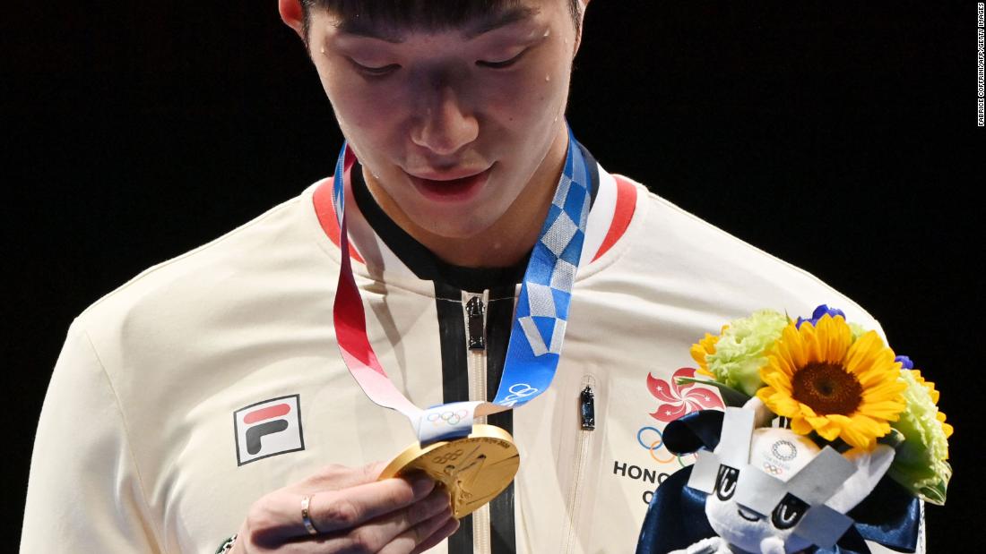 Hong Kong fencer Edgar Cheung looks at his gold medal after beating Italy&#39;s Daniele Garozzo in the men&#39;s foil final on July 26. It was &lt;a href=&quot;https://www.cnn.com/world/live-news/tokyo-2020-olympics-07-26-21-spt/h_49e87856e0c333e6f009a513d4e01e57&quot; target=&quot;_blank&quot;&gt;Hong Kong&#39;s first gold&lt;/a&gt; at the Summer Olympics in 25 years.