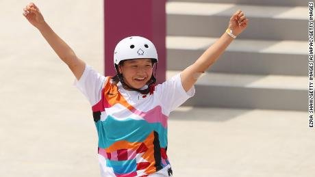 Nishiya celebrates gold in the street skateboarding final.