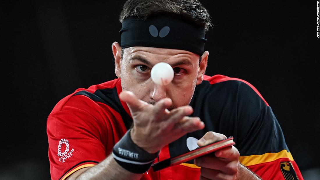 German table-tennis player Timo Boll serves during a match on July 27.
