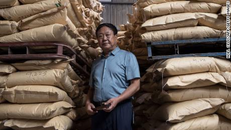 Chinese pig farmer Sun Dawu posing at a feed warehouse in Hebei, outside Beijing, on September 24, 2019. 