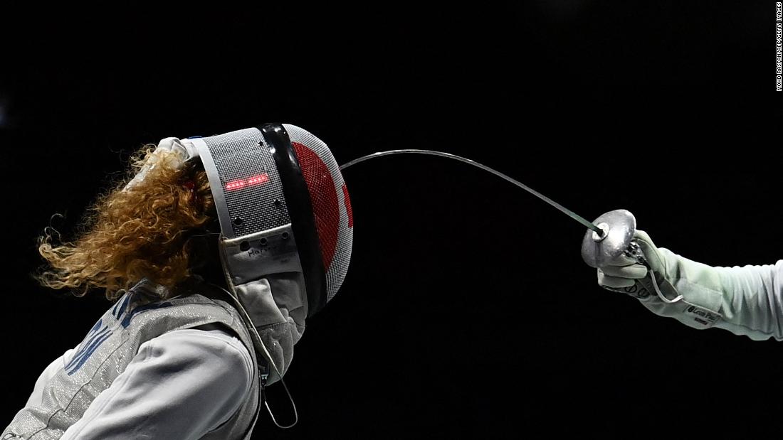 Canadian fencer Eleanor Harvey, left, competes against France&#39;s Ysaora Thibus in a foil team quarterfinal on July 29.