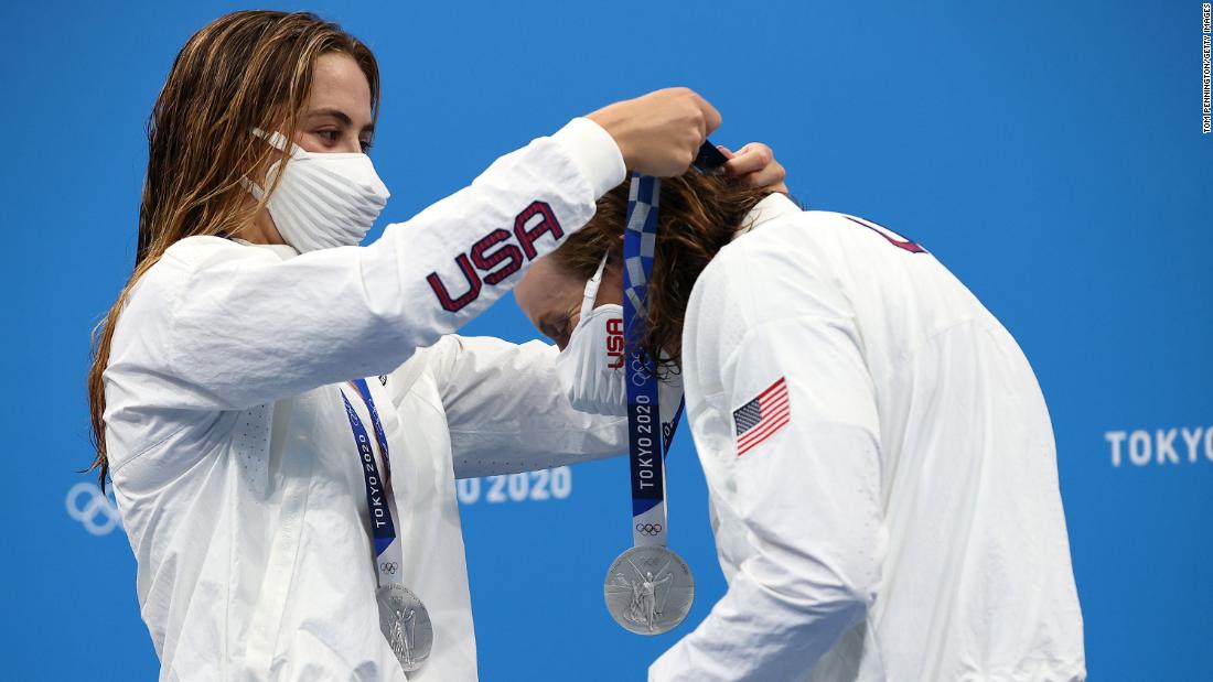 US swimmer Katie McLaughlin places a silver medal around the neck of teammate Katie Ledecky after the 4x200-meter freestyle relay on July 29. The International Olympic Committee created a contactless medal ceremony, asking athletes to put their medals on themselves. Some athletes have been &lt;a href=&quot;https://www.cnn.com/world/live-news/tokyo-2020-olympics-07-29-21-spt/h_f28d5e8948c5b62f6965c00dcfd35a2f&quot; target=&quot;_blank&quot;&gt;putting the medal on their teammates.&lt;/a&gt;