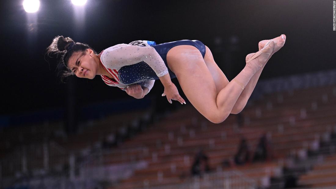Lee twists in the air during her floor exercise routine.