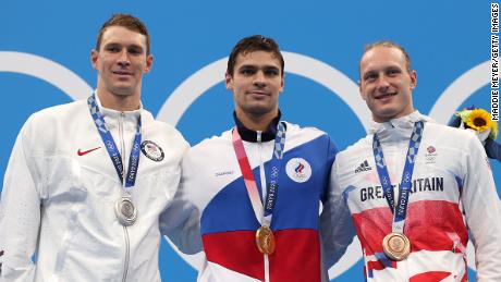 Murphy (left), Rylov (middle) and Greenbank (right) pose on the podium during the medal ceremony for the men's 200 backstroke final.
