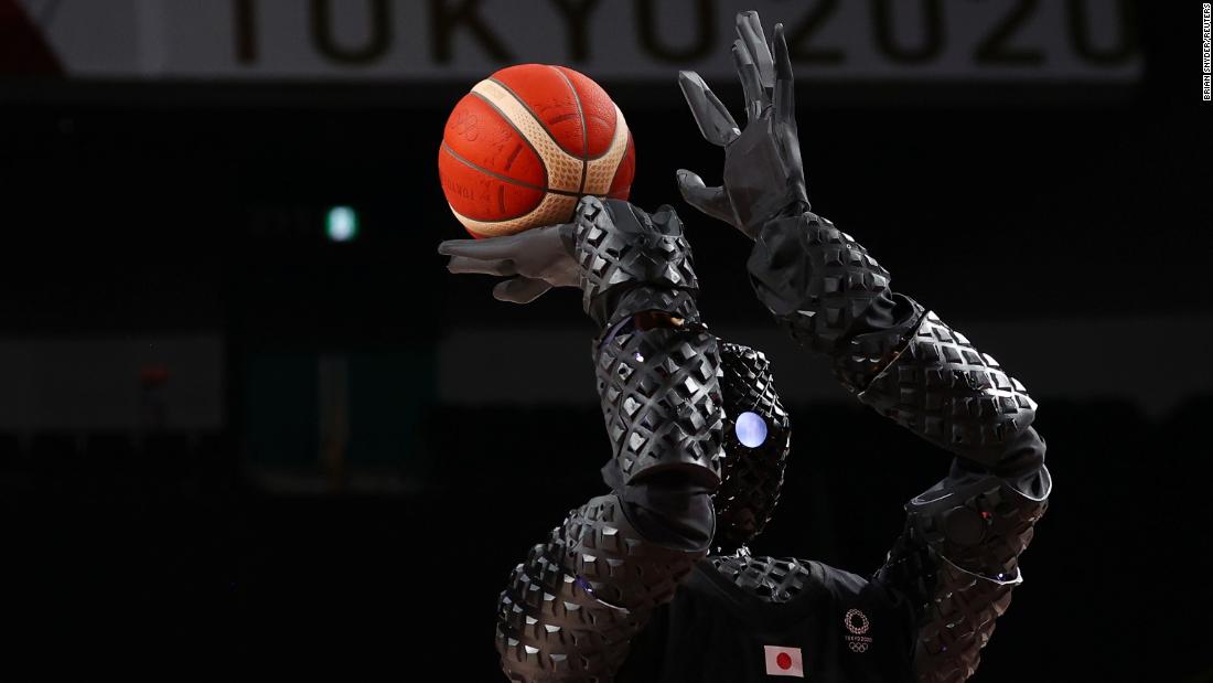 A robot shoots a free throw during halftime of a women&#39;s basketball game between Belgium and Puerto Rico on July 30. 
