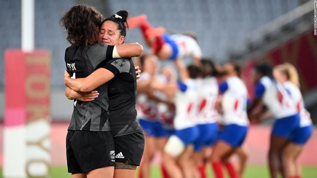 Members of New Zealand&#39;s rugby team hug after defeating France &lt;a href=&quot;https://www.cnn.com/world/live-news/tokyo-2020-olympics-07-31-21-spt/h_c290ab55510bd8ce401aa12537d8b410&quot; target=&quot;_blank&quot;&gt;to win gold&lt;/a&gt; on July 31.