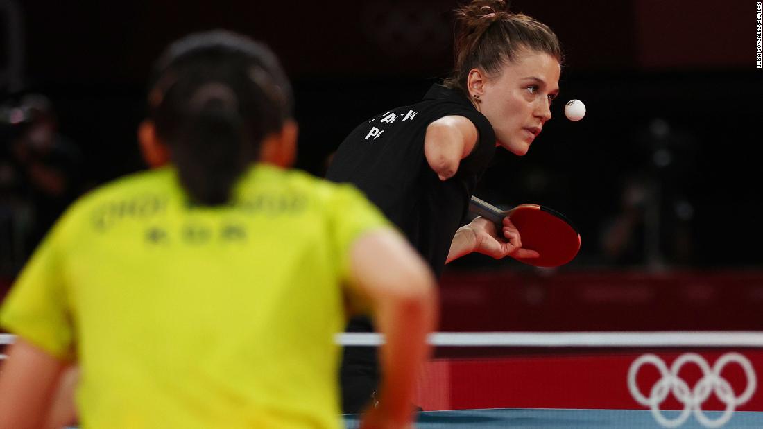 Polish table-tennis player Natalia Partyka, who was born without a right hand and forearm, eyes the ball during a doubles match on August 2. In the foreground is South Korea&#39;s Choi Hyo-joo. Partyka has competed in both the Olympics and the Paralympics.