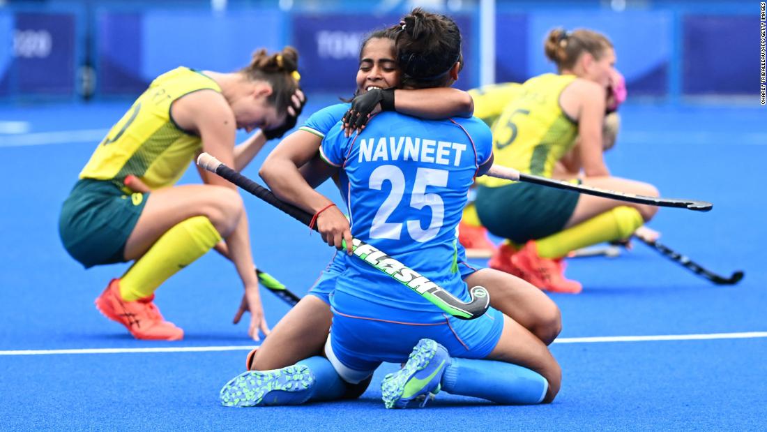 India&#39;s Neha Goyal embraces Navneet Kaur after a 1-0 win over Australia in a field hockey quarterfinal on August 2.